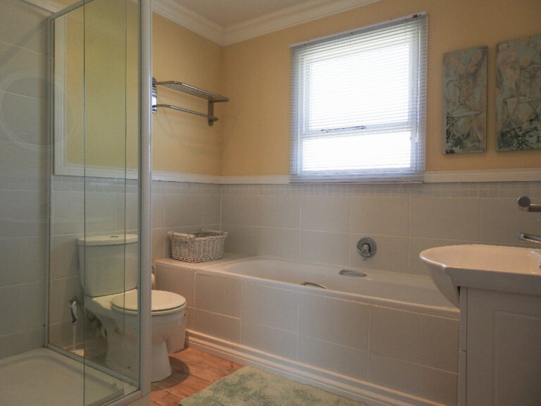 Shared full bathroom with bath, basin and shower