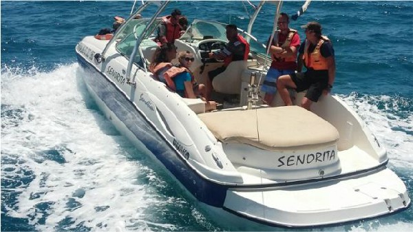 Speedboat with passengers on the water in Mossel Bay